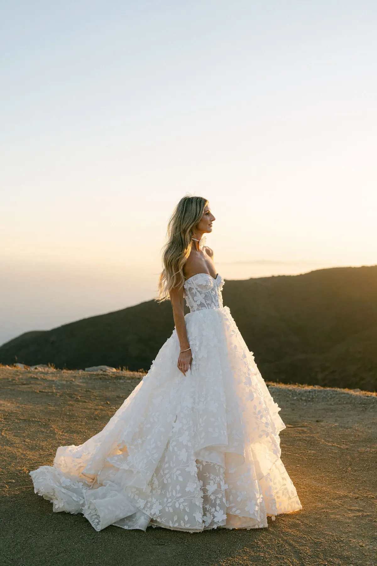 The bride wear gracefully in her flowing white gown