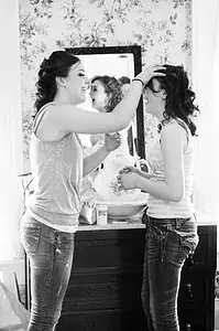 Bride and Maid of Honor laughing together.