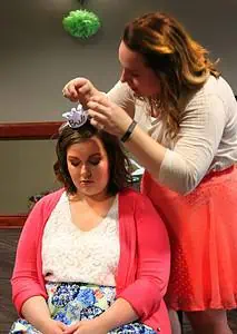 Maid of Honor helping bride before bridal shower.