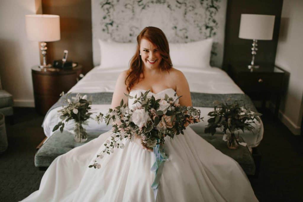 bride-posing-in-her-wedding-dress