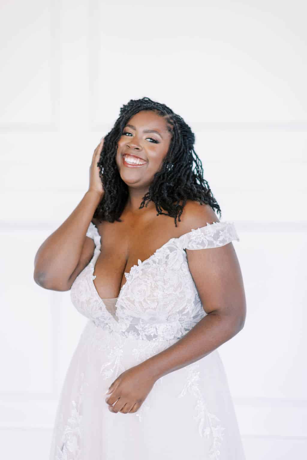 busty black woman wearing wedding dress