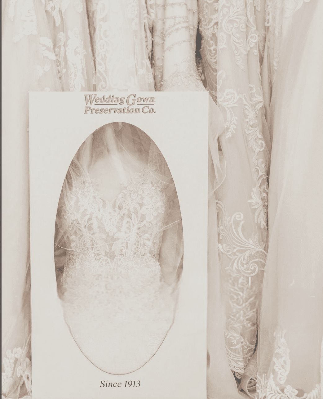 wedding dress inside white cardboard case after wedding dress cleaning and preservation