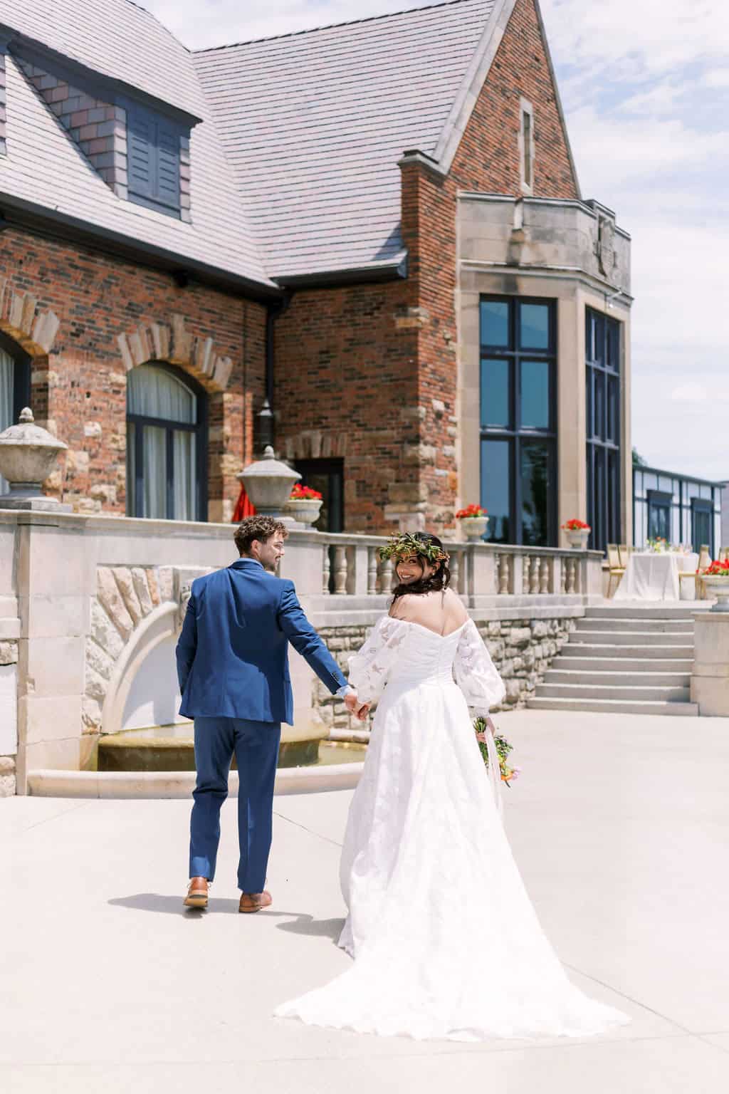 image of a happy couple holding hands after the ceremony.