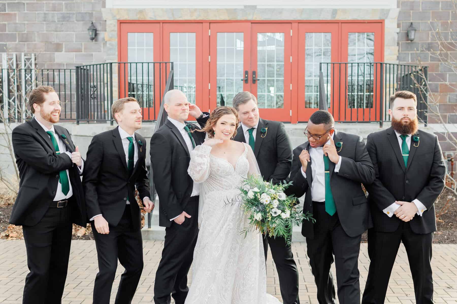 image of the couple with the groomsmen.