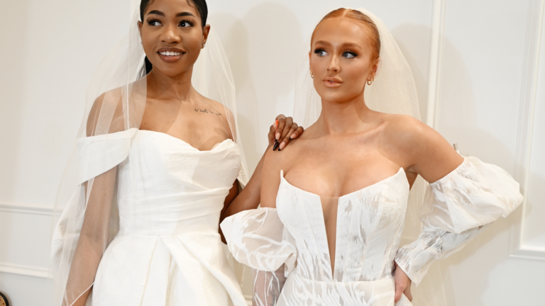 two beautiful brides on their dream wedding dresses