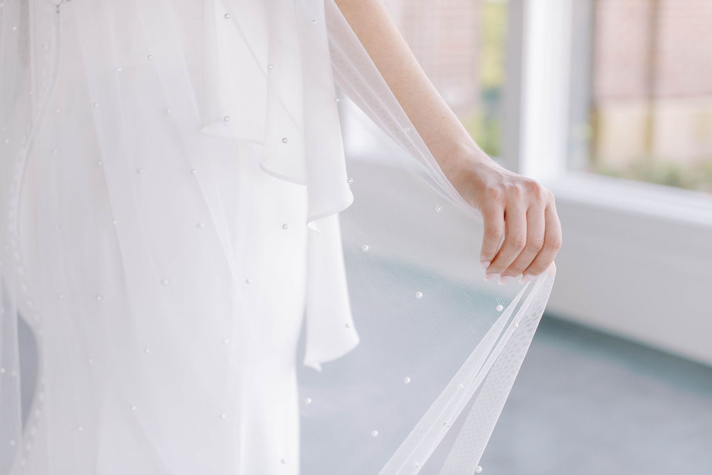 bride holding veil