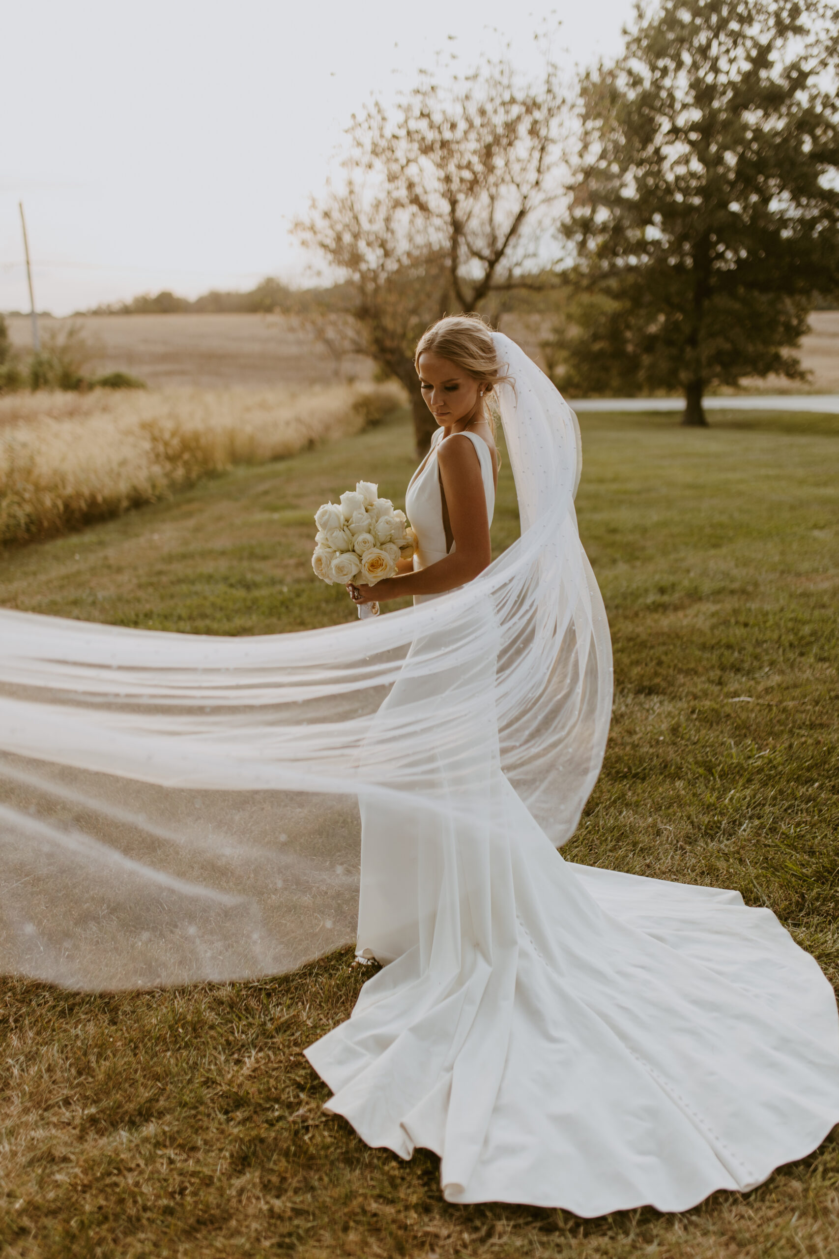 The bride is wearing her luxurious wedding dress.