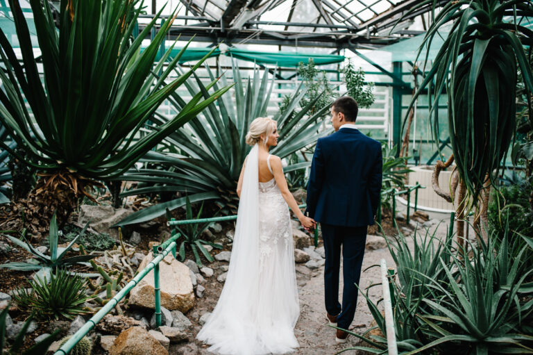 bride and groom in botanical wedding venue