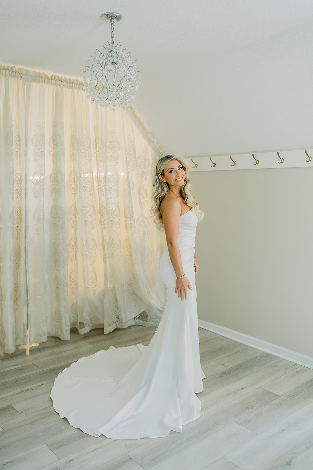 Bride wearing a beautifully tailored strapless wedding dress that perfectly hugged her body.