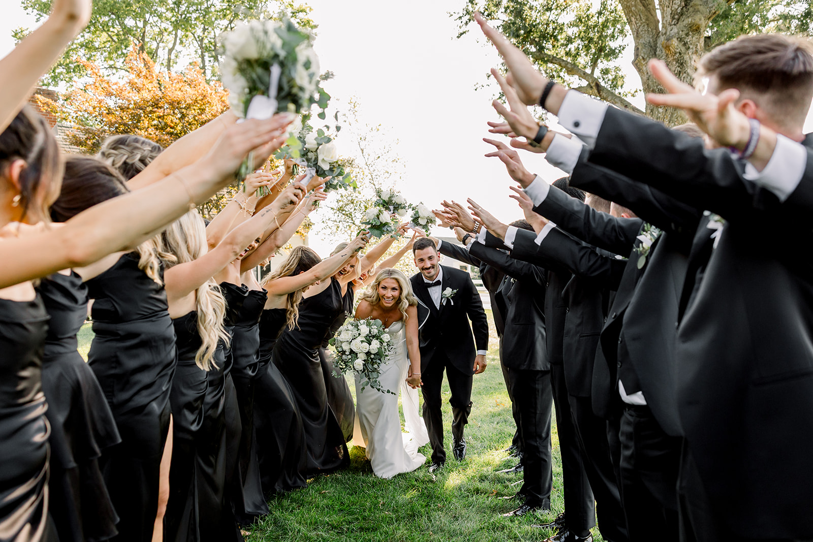 They walked out hand-in-hand, surrounded by cheering friends and family.