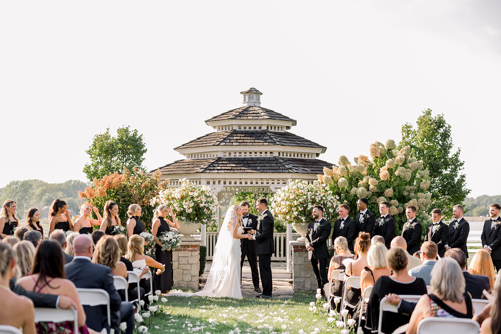 The wedding ceremony in the lush, open-air space venue.