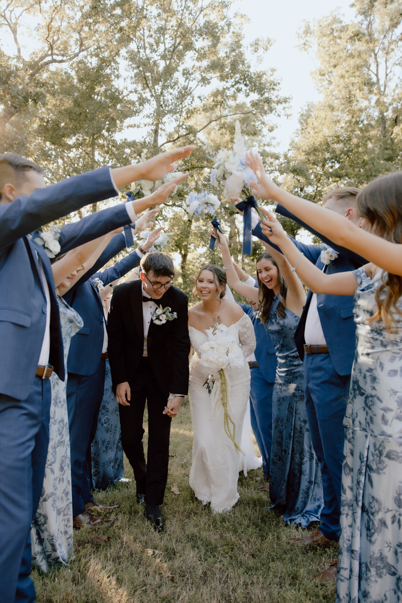 Savvy bride Lauren and Ryan together with their entourage wore blue patterned dresses and crisp blue suits 
