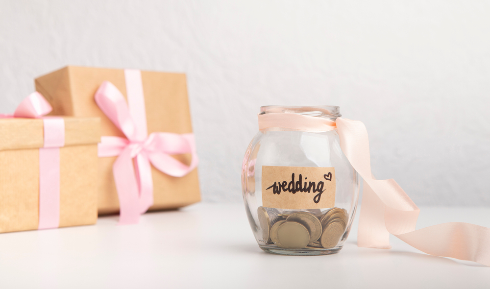 A coin jar labelled "wedding"