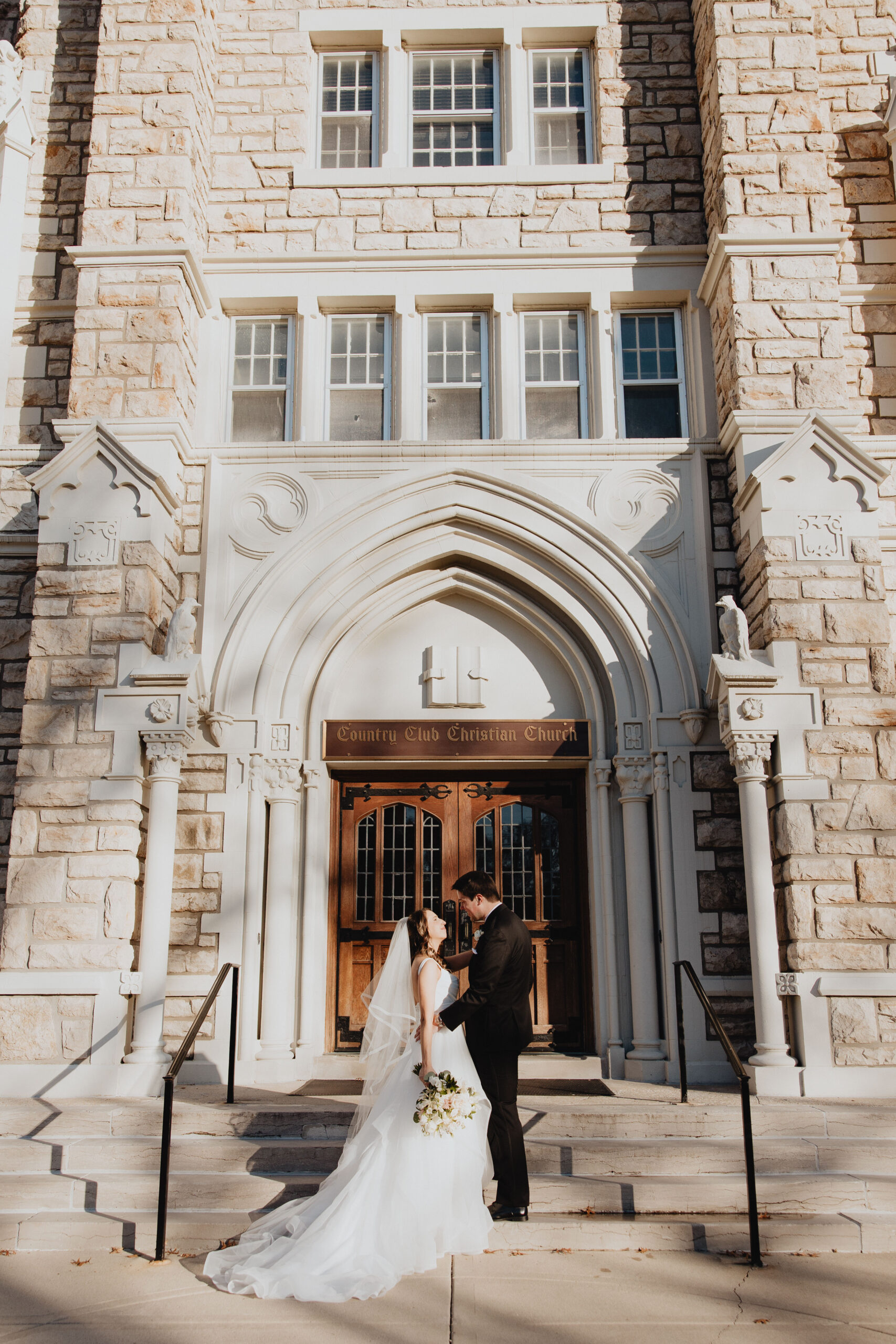 Caroline and Dave portrait session outside the church front door.