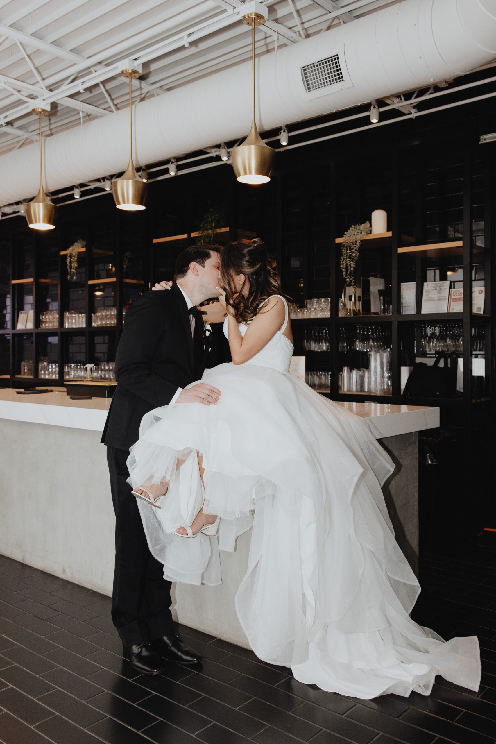 couple intimate share intimate kiss in the reception counter bar.