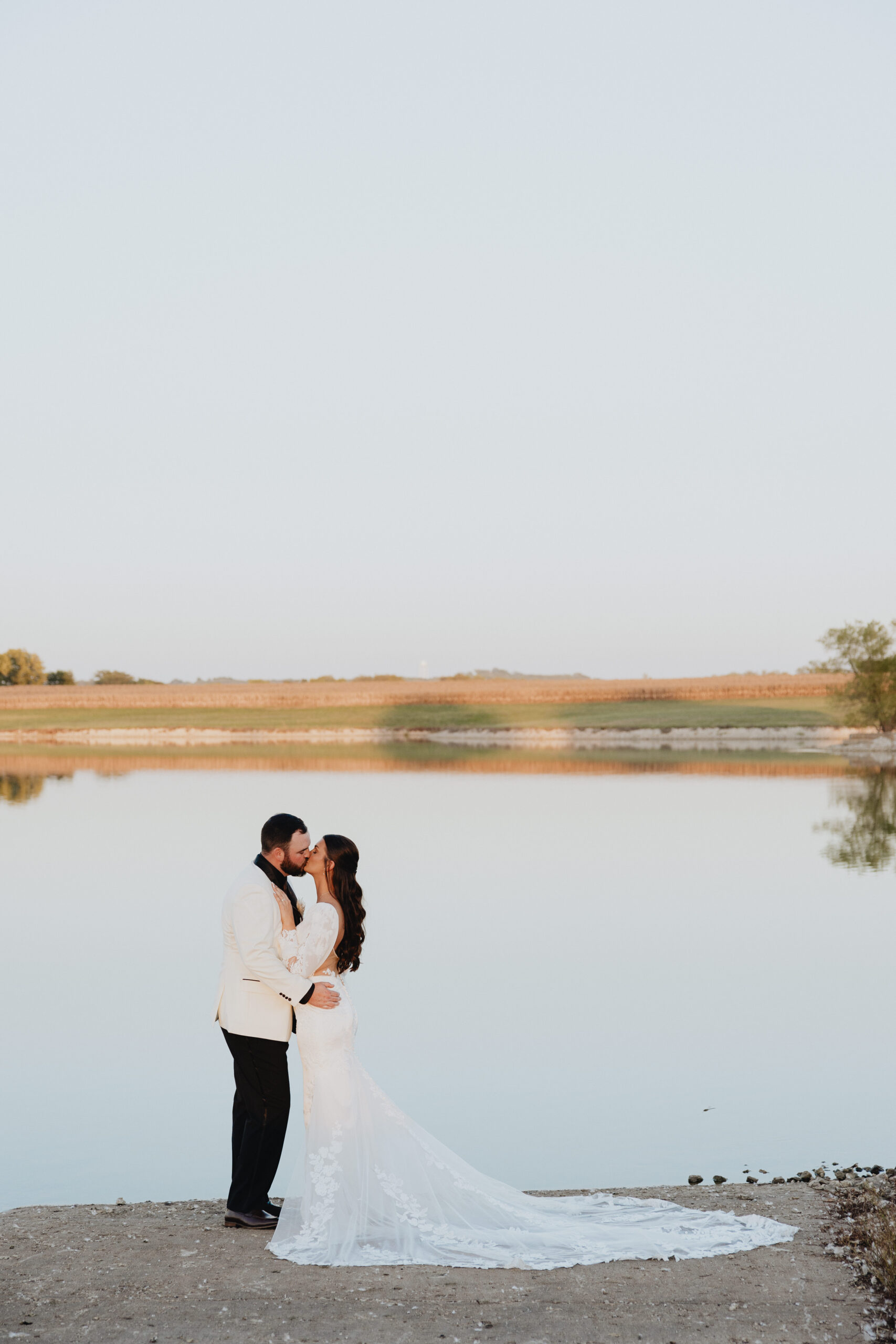 Kelsey and Colby’s portraits in the field beautiful horizon in the background.