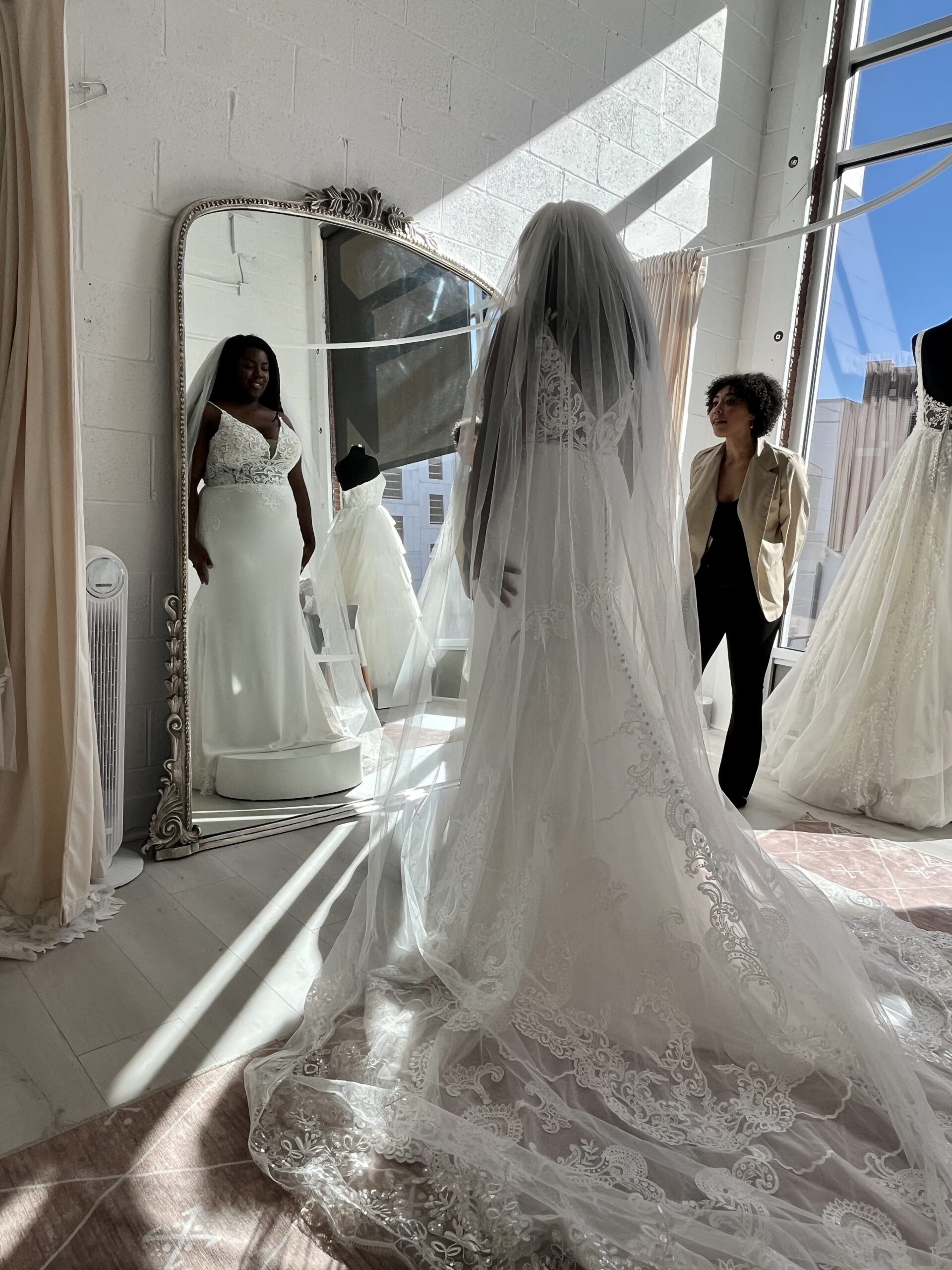 Cierra trying on bridal gowns during her at appointment at Savvy Bridal.