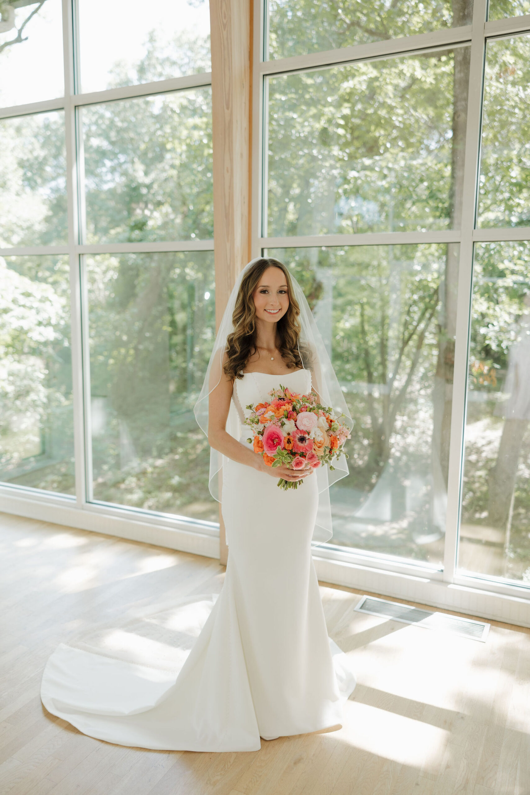 Savvy bride Grace wearing a minimalist crepe gown paired perfectly with veil and a beautiful bouquet.