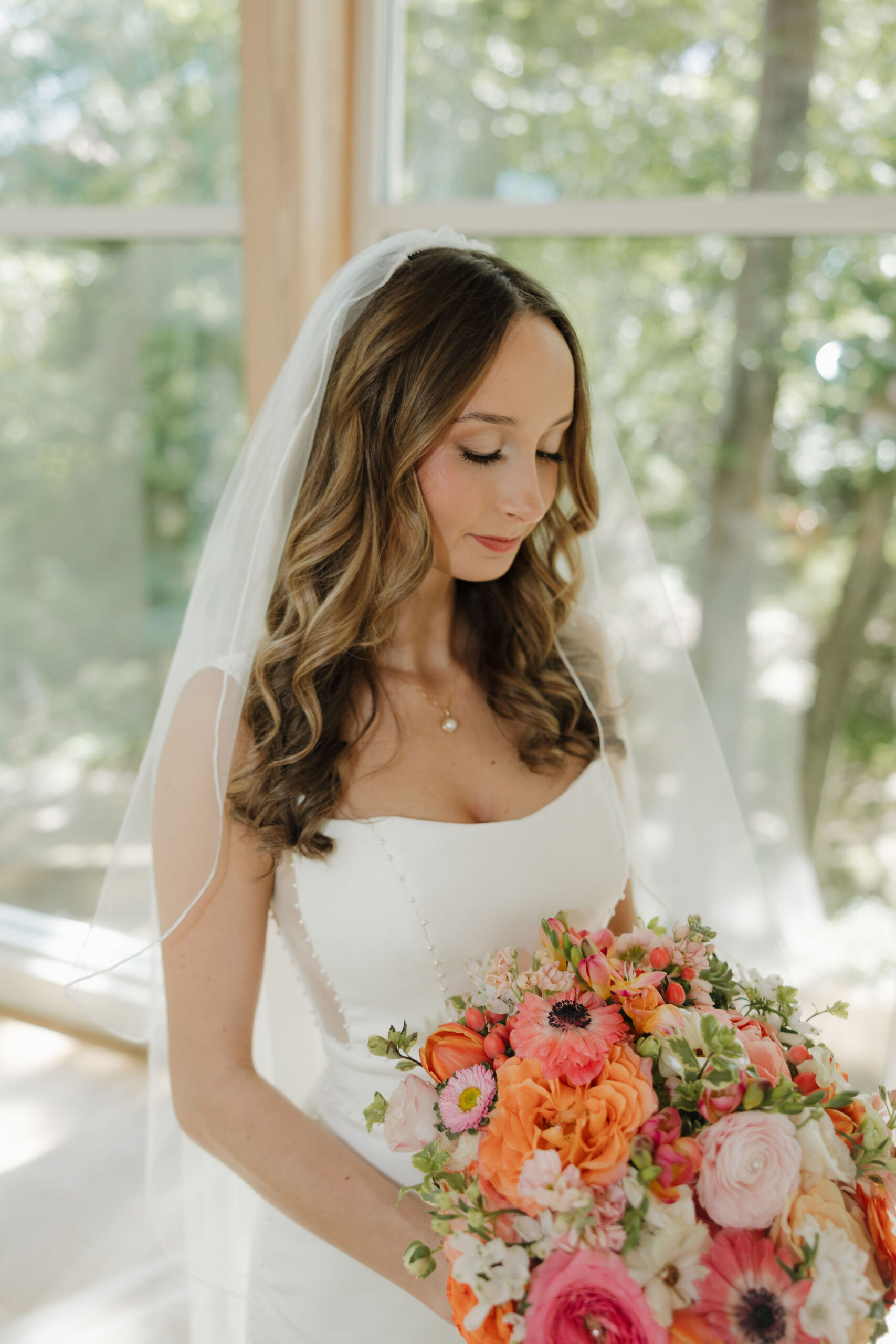 Savvy bride Grace wearing a minimalist crepe gown paired perfectly with veil.