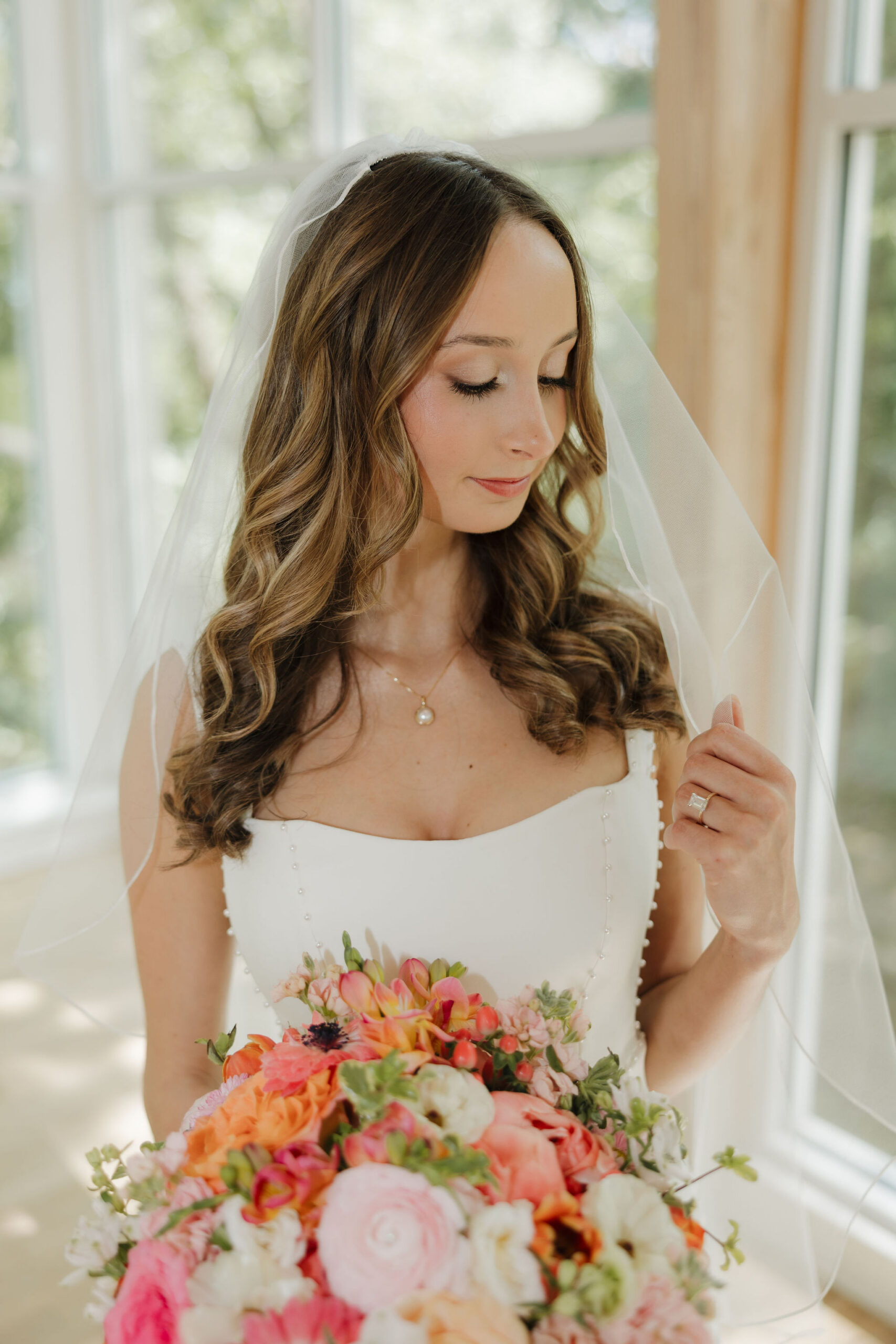 Savvy bride Grace wearing a minimalist crepe gown paired perfectly with veil.