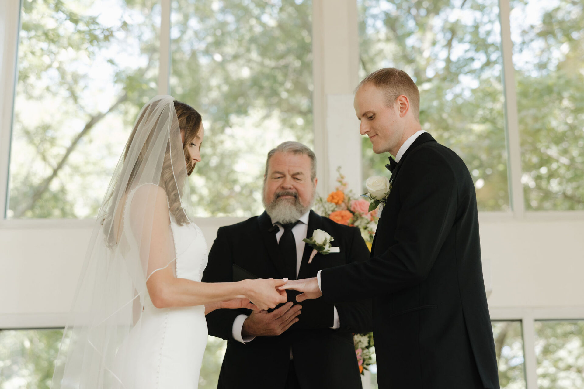 Grace and Brett exchanging wedding rings during the wedding ceremony
