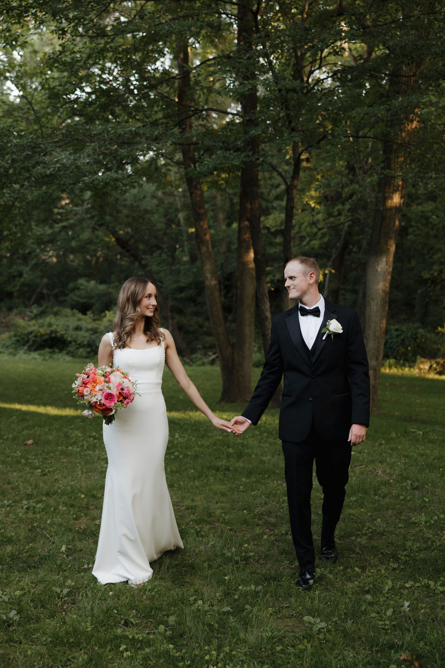 portrait image of Grace and Brett under beautiful greenery background of shaded tress