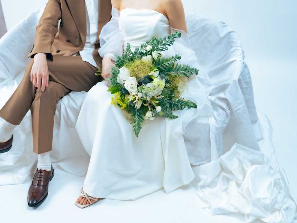 woman in wedding dress and man in casual tuxedo. Bridal photo. Wedding photo.