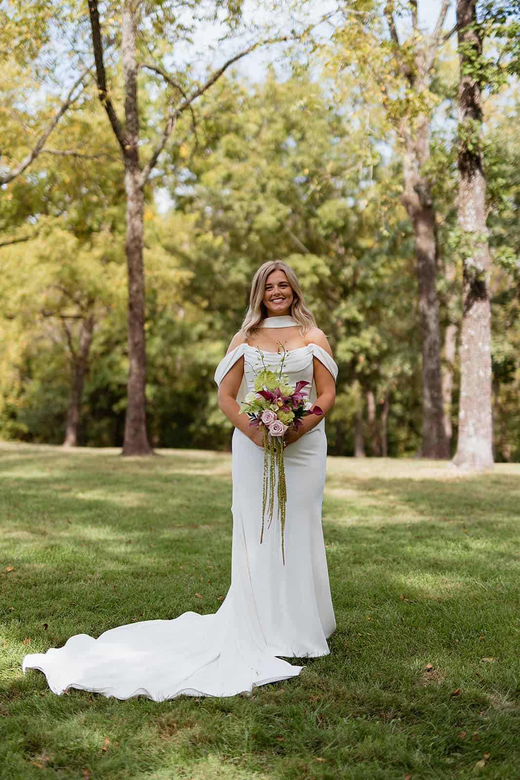 Savvy Bride Sydney wearing a bridal gown from Savvy Bridal, an off-the-shoulder neckline brought a soft romantic element to the otherwise modern silhouette, while the fitted shape flowed into a beautiful train.