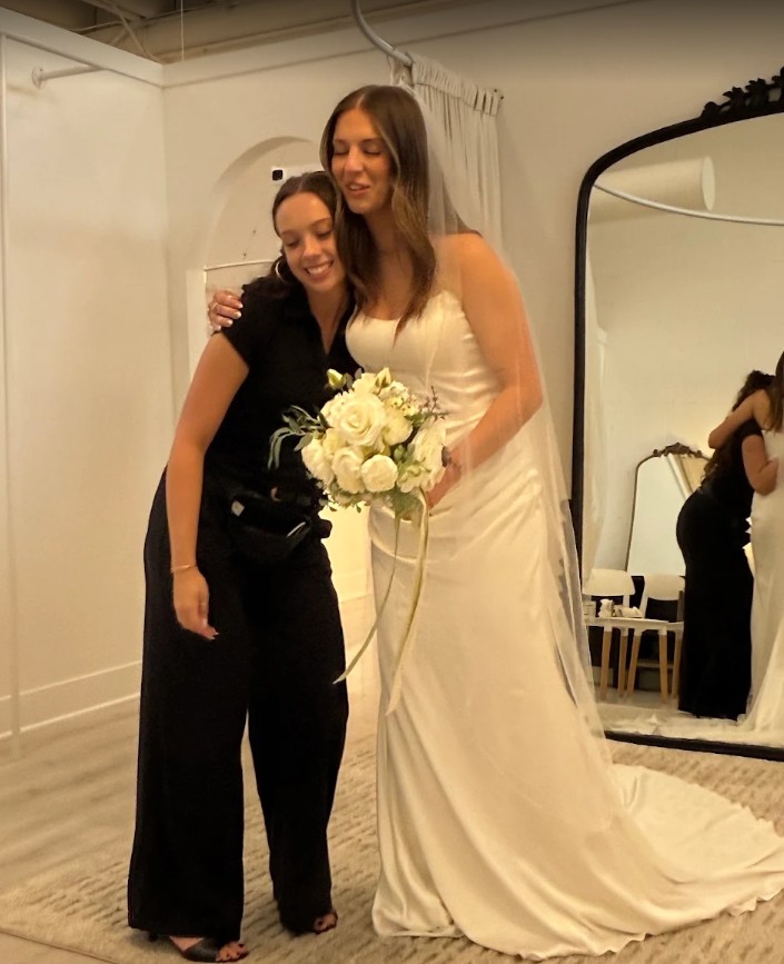 Happy bride celebrates finding her dream wedding dress with her Savvy Bridal stylist.